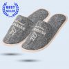 A pair of dark gray felt slippers with a slanted design and custom embroidery reading “Hussnhof Farm Lodge.” Includes a “Best Seller” label in the upper corner.