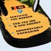 Close-up of the text printed on the sole of the flip-flop certifying the use of biodegradable materials, renewable energy, and environmentally friendly manufacturing processes.