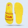 A top-down view of a yellow sandal featuring the inscription “CGN” in red and a graphic on the insole. Next to it, the bottom of the sandal (the sole) is shown, revealing a pattern of circles and a non-slip texture for better traction.
