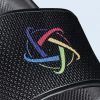 Close-up of the upper strap of the black flip-flop showing an embossed grid pattern and the logo printed in vibrant, intertwined colors.