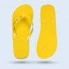 A composition showing a yellow flip-flop from above with the text “TOSKANA THERME” and another upside down, revealing the non-slip embossed sole.